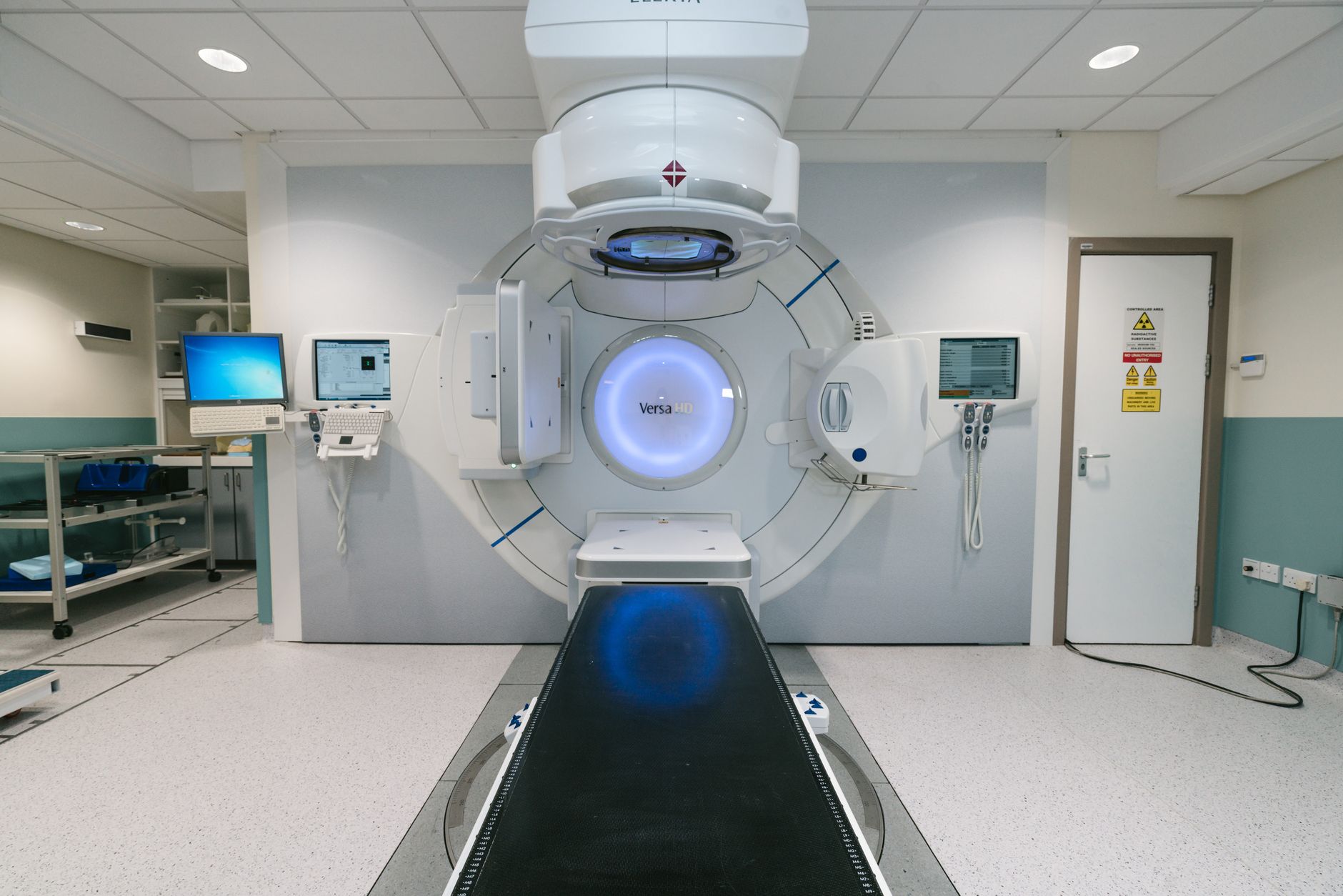 A sterile medical room featuring advanced oncology treatment equipment designed for minimally invasive procedures.